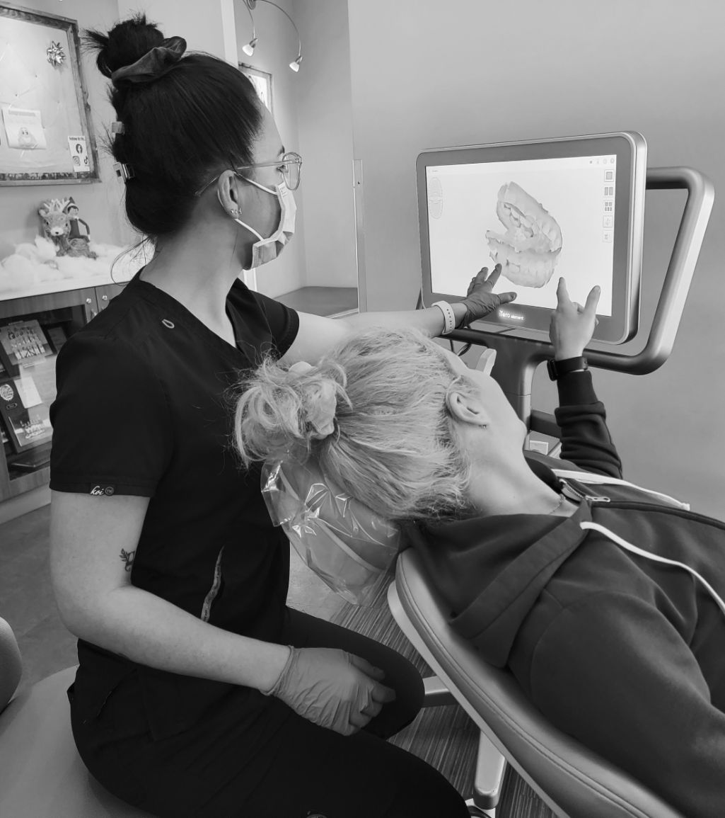 Team member showing patient a digital scan of your teeth